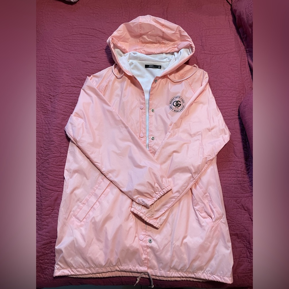 Woman’s pink Obey windbreaker